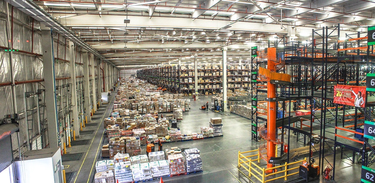 distribution center with forklifts and piles of product