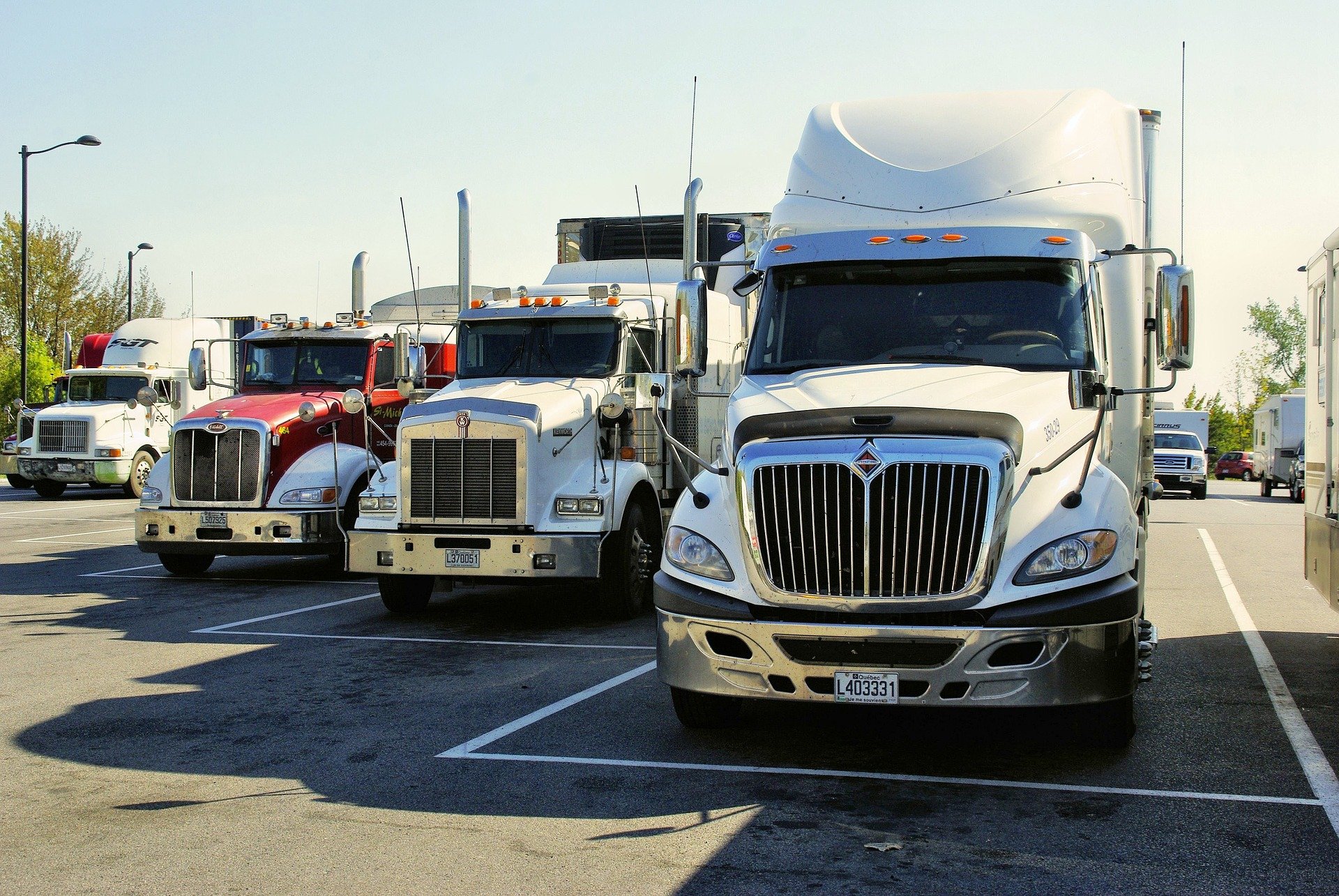 freight trucks parked at a truck stop