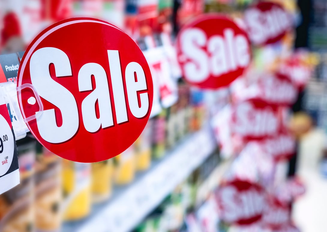 sale sign on a grocery store shelf