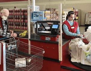 A customer checking out at a Bargain Barn location in Tennessee