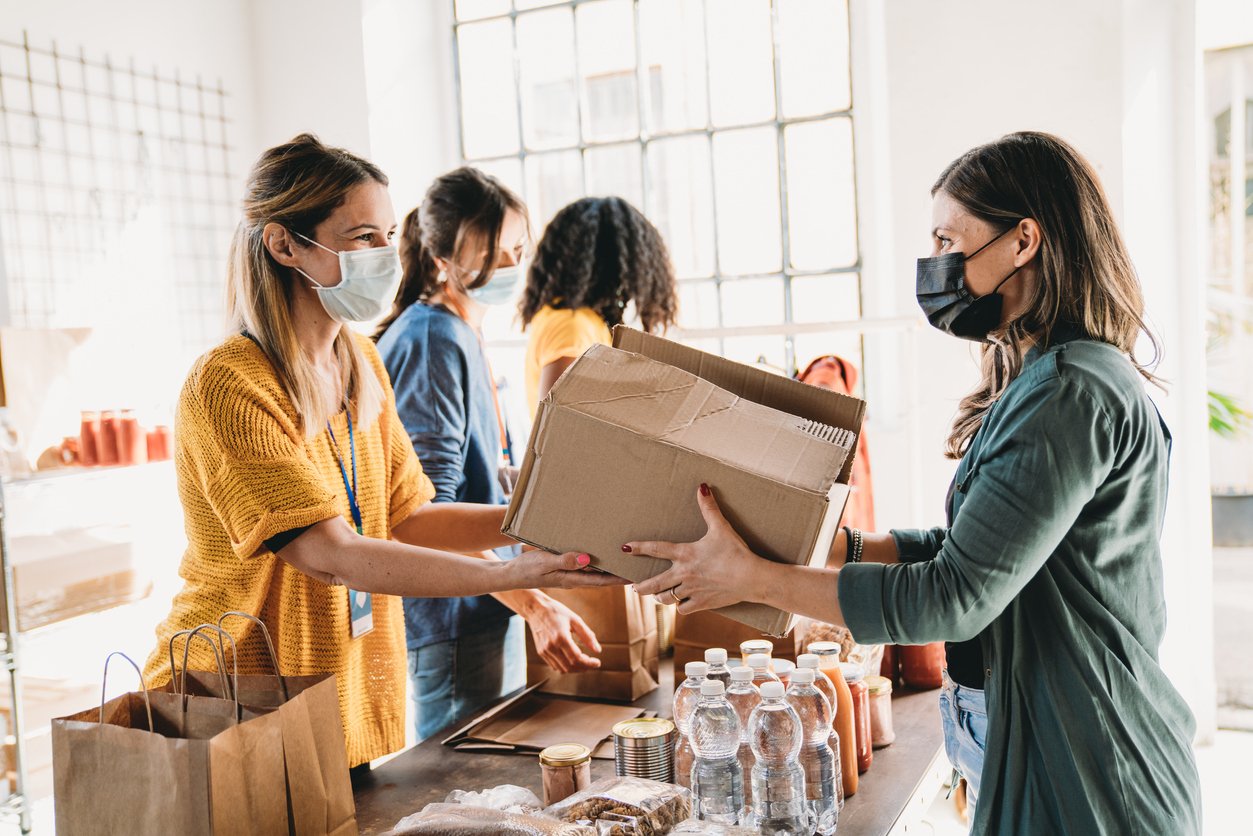 woman-donating-box-of-food