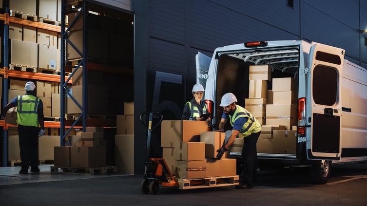 workers-loading-pallet-from-van