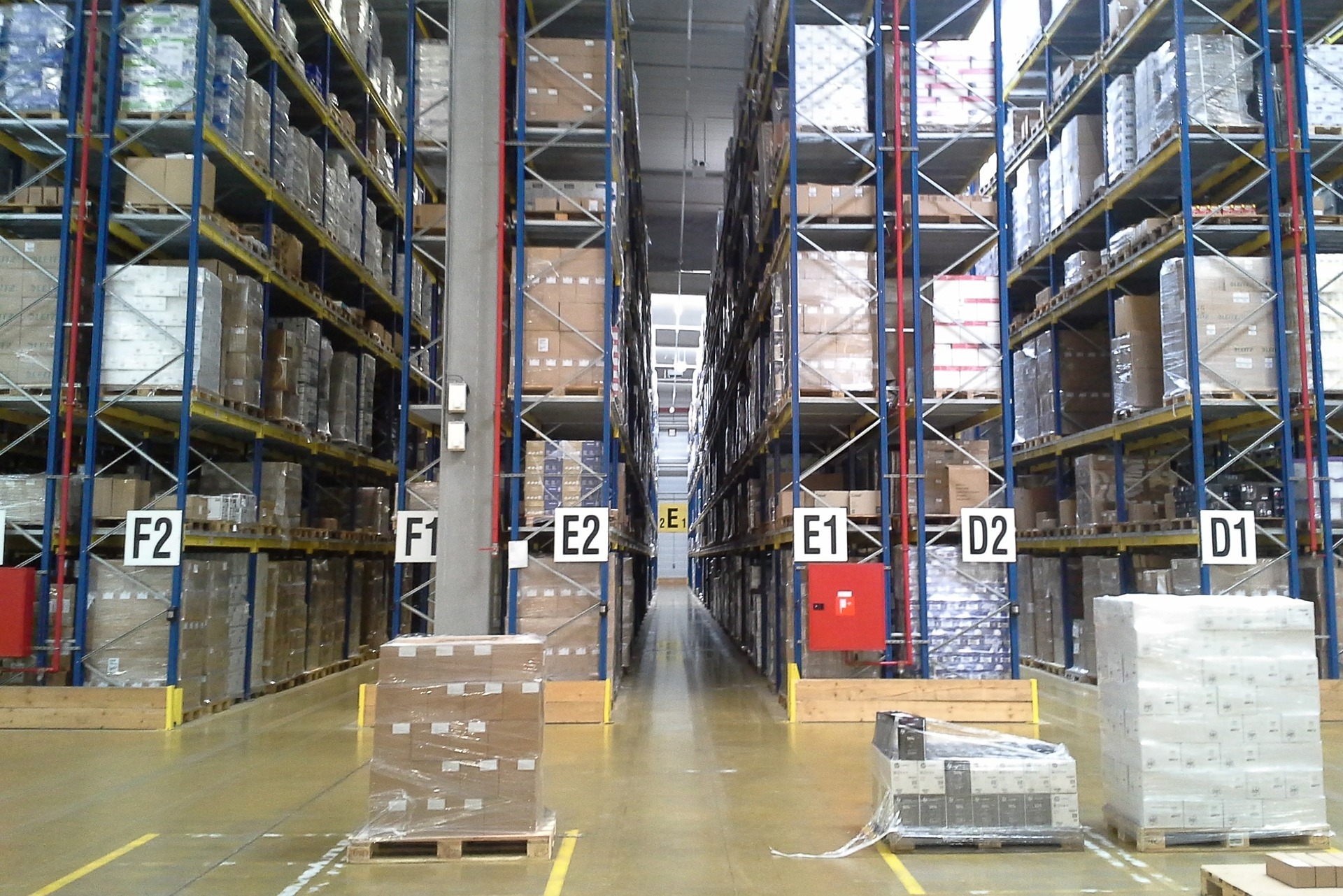 Full stockroom shelves in a warehouse with excess inventory